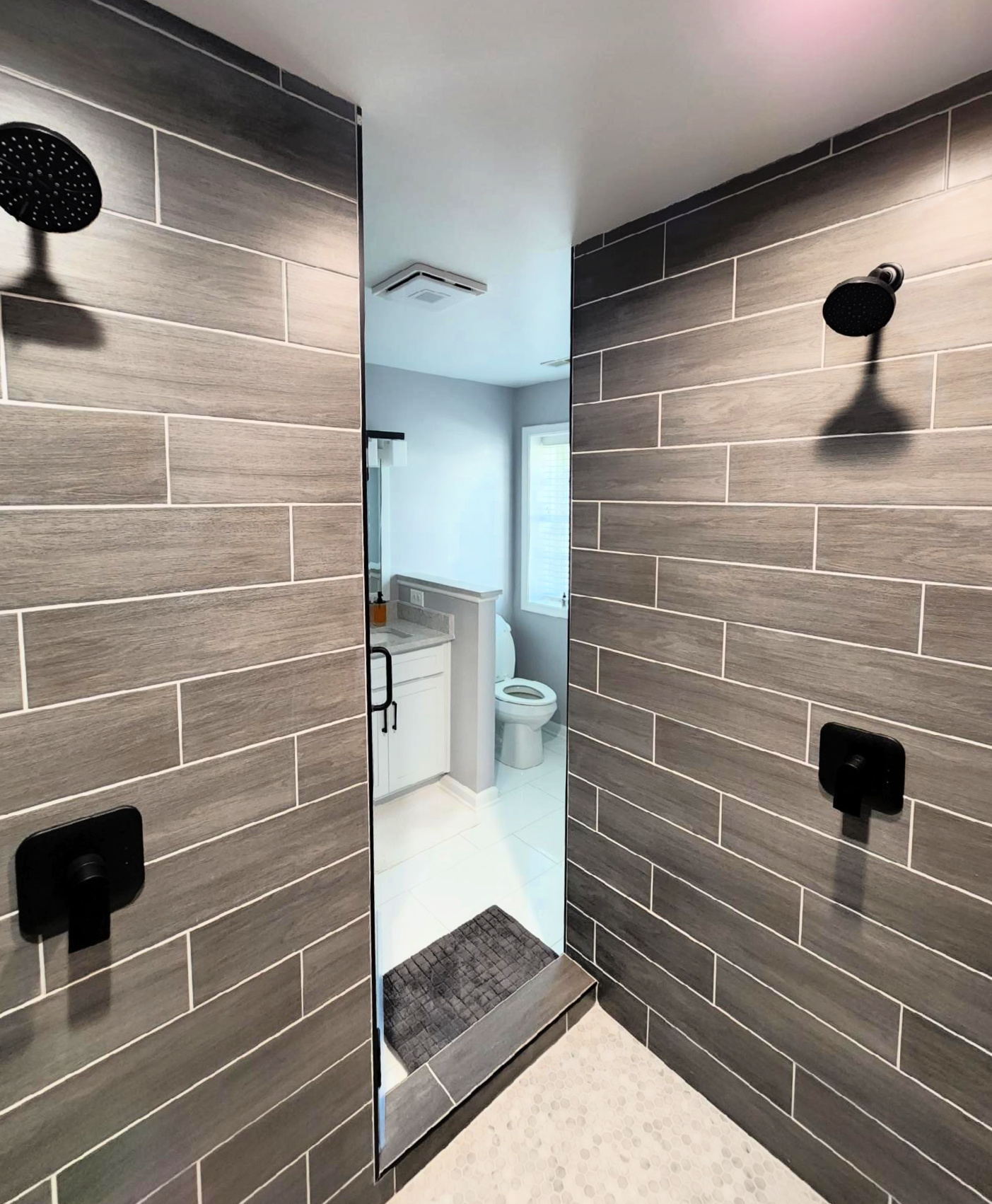 Shower updated with brand new tile installation. Brand new tile install.