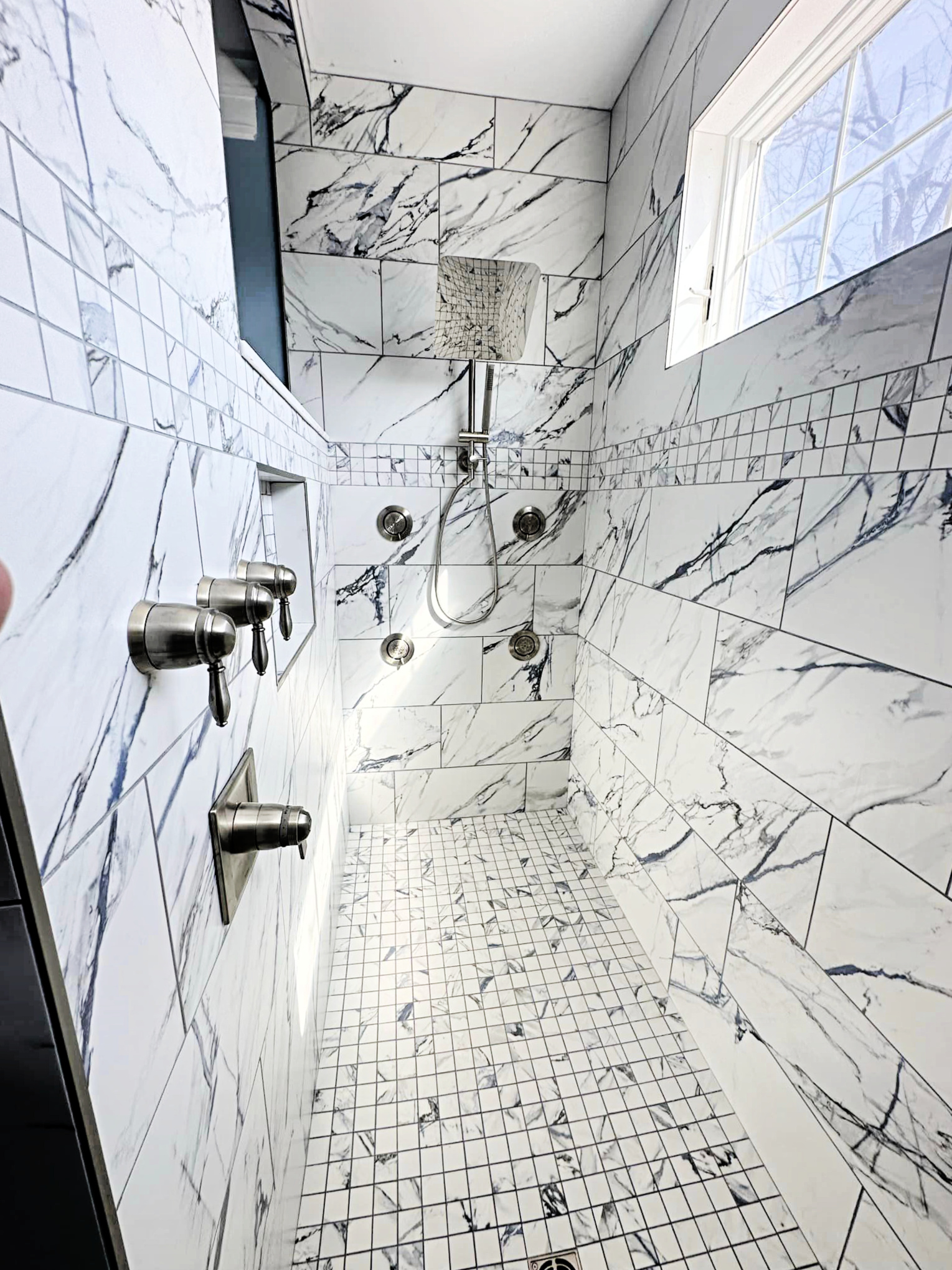 Walk in shower with custom tile. Tile installation. Tile services
